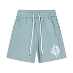 AMIRI Starburst logo shell swim shorts